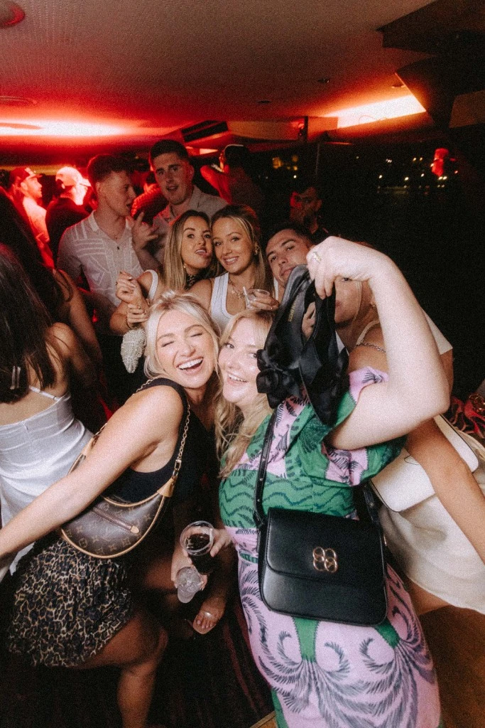 Group of friends celebrating at a Throwback party